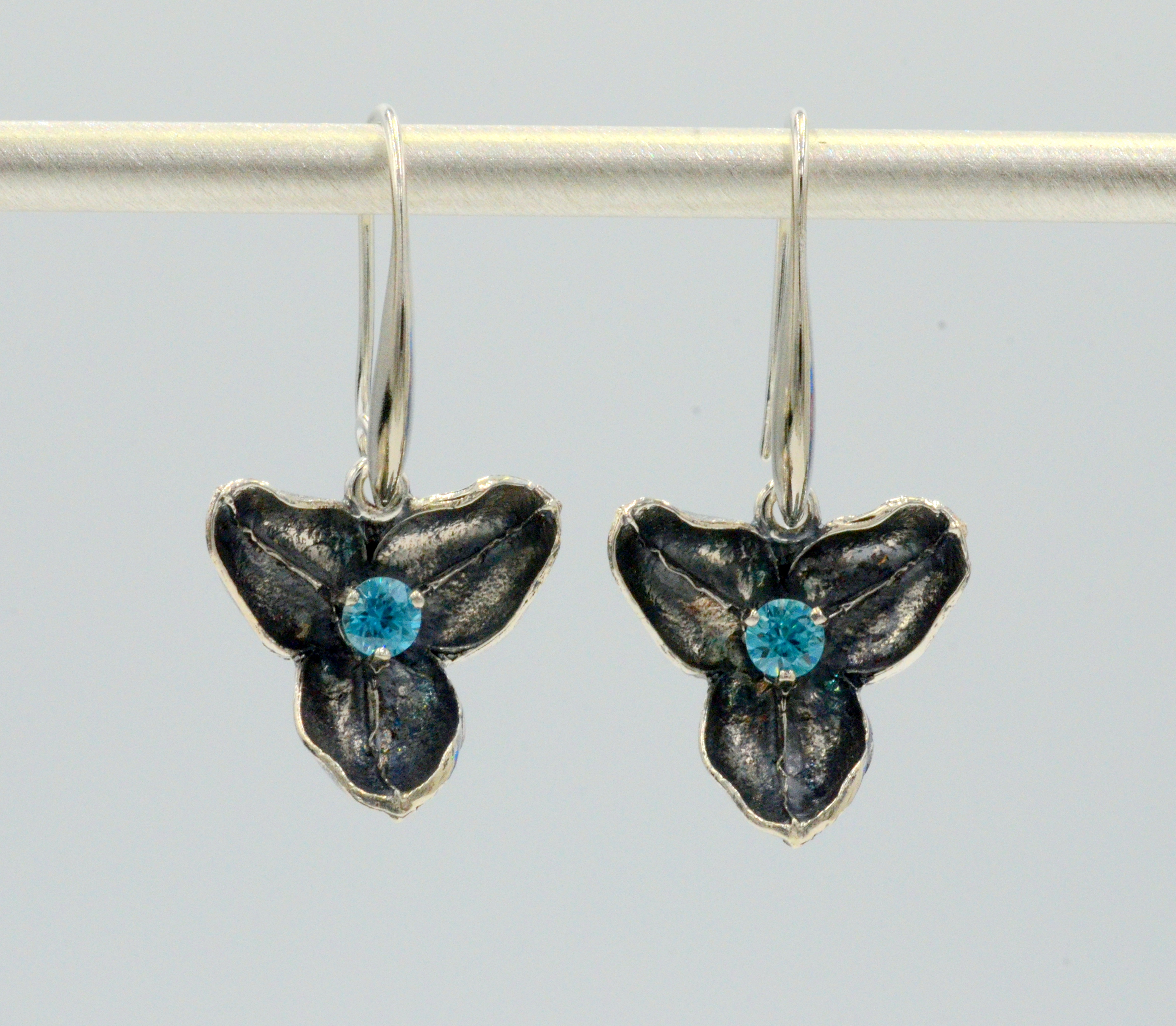 Natural Leaf converted into a solid Sterling Silver Euro Charm.Set with beautiful Blue Zircons. Comes with a Sterling Silver French wire earring or can be worn with our Euro Wires. Shy 3/4 inch square. Euro Charm Earrings to be worn with our signature Euro Wires. Go to "About Store" for more information in regard to our Euro Wires.